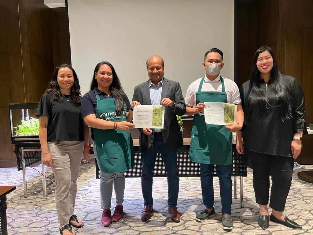 Presentation of certificates of participation to hotel staff